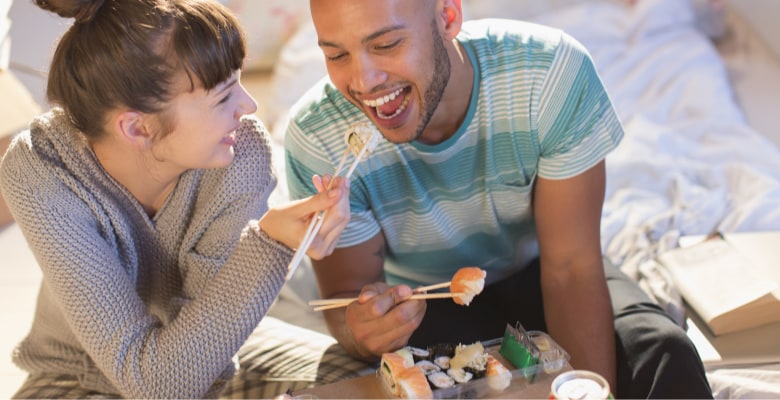 Couple enjoying sharing food.