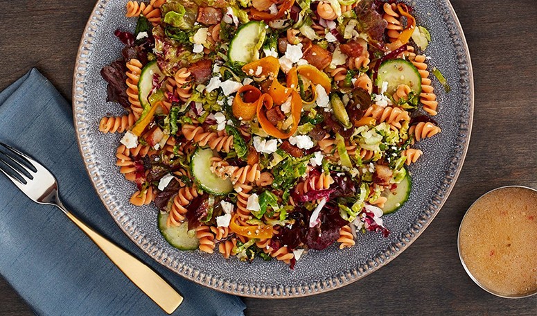 Red Lentil Pasta Bowl A prepared bowl of red lentil pasta offers plant based proteins full of flavours.